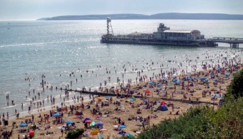 A busy Bournemouth beach and pier