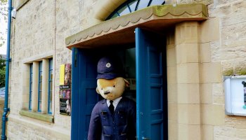 Entrance to Ilkley Toy Museum with police bear